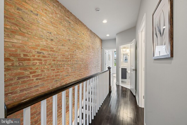 823 11th St NE, Washington, DC 20002 - hallway featuring recessed lighting, dark wood-style floors, baseboards, an upstairs landing, and brick wall