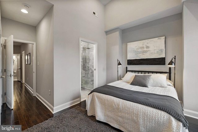 823 11th St NE, Washington, DC 20002 - bedroom featuring baseboards, wood finished floors, and ensuite bath