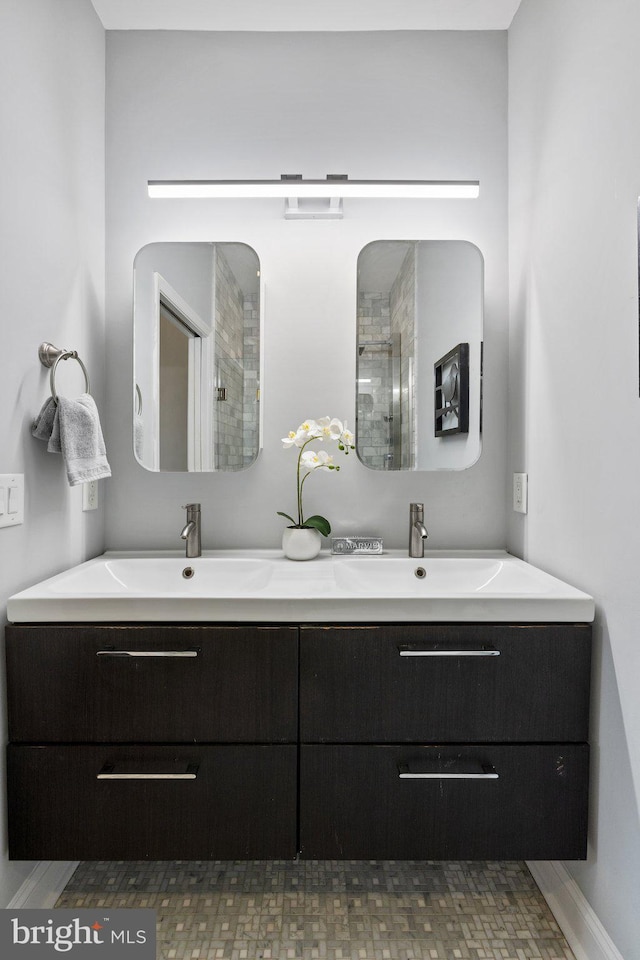 823 11th St NE, Washington, DC 20002 - full bathroom with a tile shower, double vanity, and baseboards