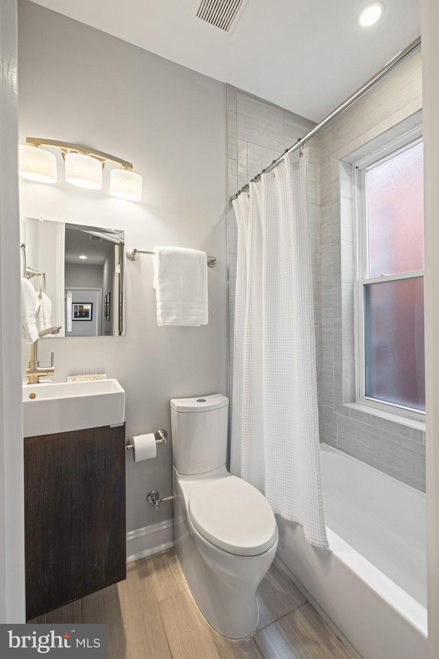 823 11th St NE, Washington, DC 20002 - full bathroom with toilet, vanity, shower / bath combo with shower curtain, recessed lighting, and baseboards