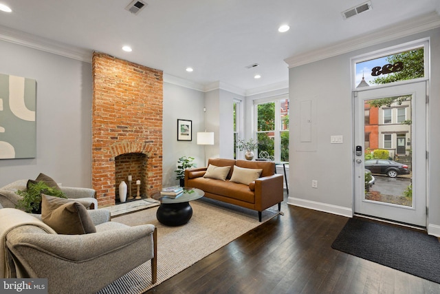 823 11th St NE, Washington, DC 20002 - living room with dark wood-style flooring, a fireplace, recessed lighting, baseboards, and crown molding