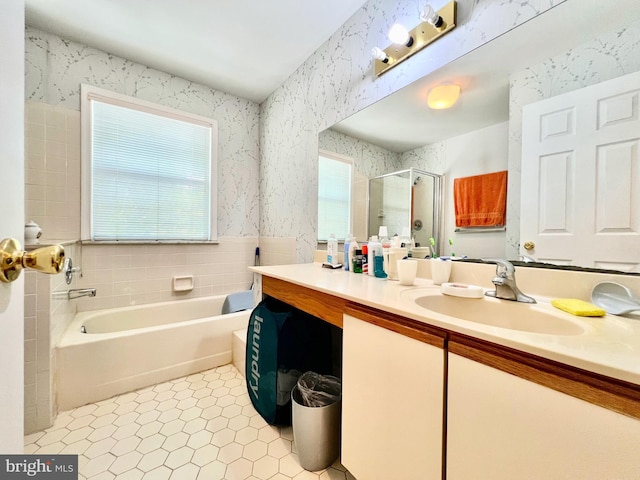 full bath with wallpapered walls, a shower stall, a bath, vanity, and tile patterned flooring