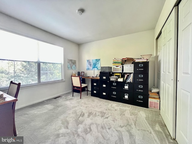 office space with carpet floors and baseboards