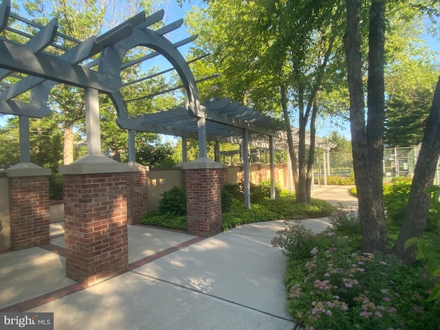 surrounding community featuring a pergola