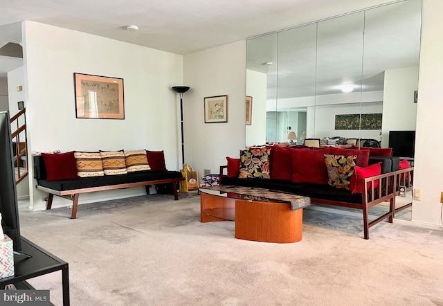 living area featuring carpet floors