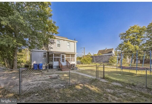 840 S 2nd St, Millville, NJ 08332 - rear view of house with a sunroom and a gate