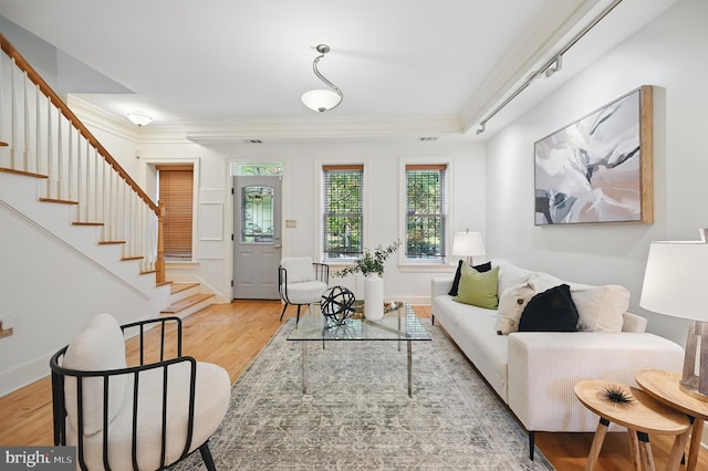 516 K St NE, Washington, DC 20002 - living room with crown molding, stairs, wood finished floors, and baseboards