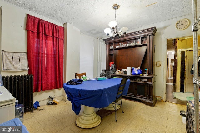 1625 6th St NW, Washington, DC 20001 - dining room with tile patterned floors, radiator heating unit, a chandelier, and a textured ceiling