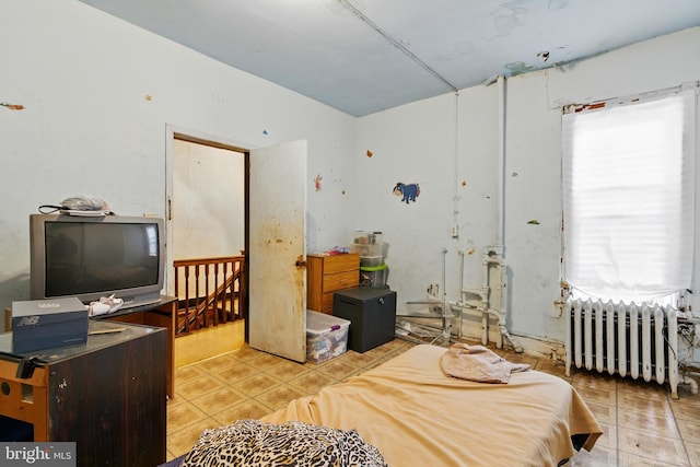 1625 6th St NW, Washington, DC 20001 - tiled bedroom featuring radiator heating unit