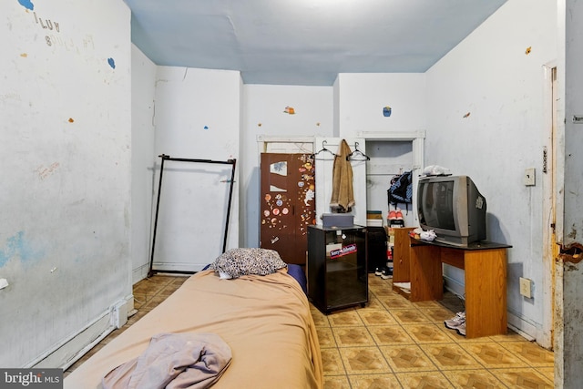 1625 6th St NW, Washington, DC 20001 - bedroom featuring light tile patterned floors, a baseboard heating unit, and a spacious closet