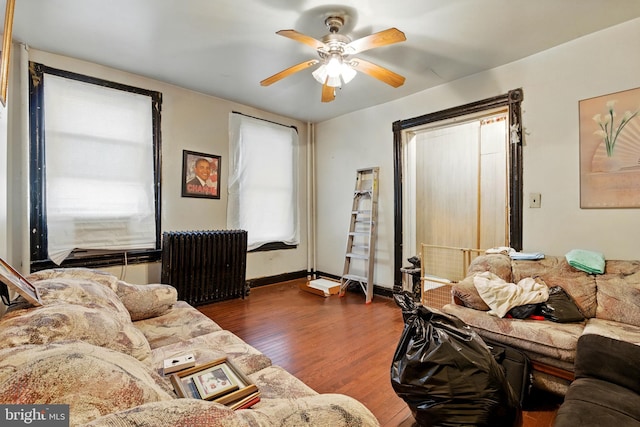 1625 6th St NW, Washington, DC 20001 - living area with radiator, wood finished floors, and a ceiling fan
