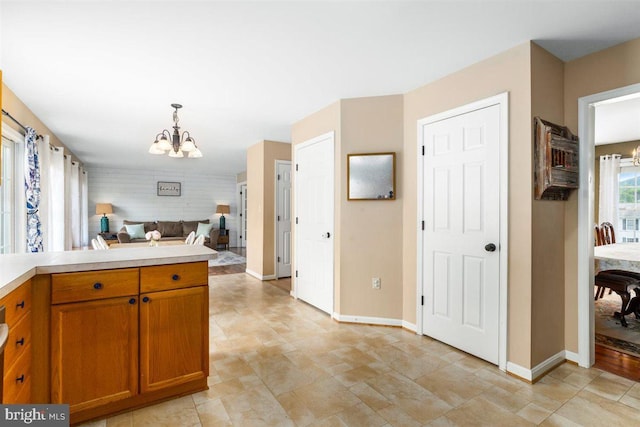 105 Bachtell Cir, Smithsburg, MD 21783 - kitchen featuring a chandelier, light countertops, baseboards, pendant lighting, and open floor plan