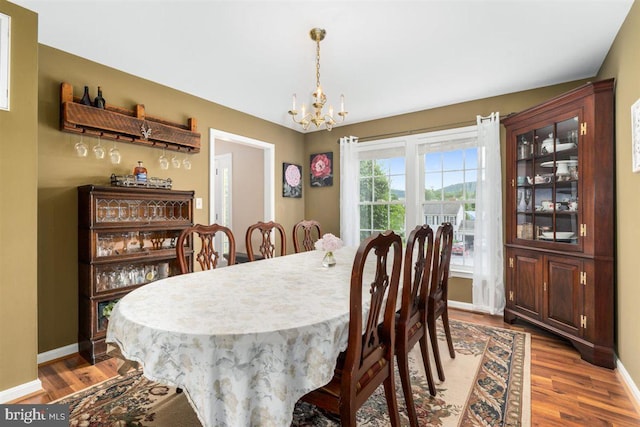 105 Bachtell Cir, Smithsburg, MD 21783 - dining area with a chandelier, wood finished floors, and baseboards