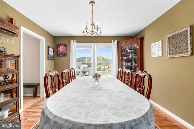 105 Bachtell Cir, Smithsburg, MD 21783 - dining space with light wood-style flooring, a chandelier, and baseboards