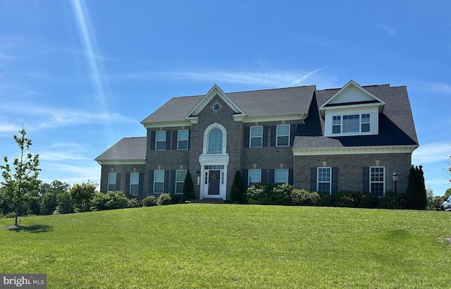 42506 Black Talon Ct, Leesburg, VA 20176 - georgian-style home featuring a front yard and brick siding