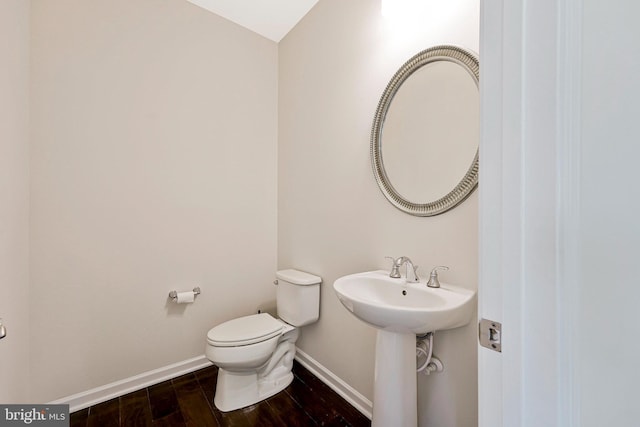 42506 Black Talon Ct, Leesburg, VA 20176 - bathroom with toilet, wood finished floors, and baseboards