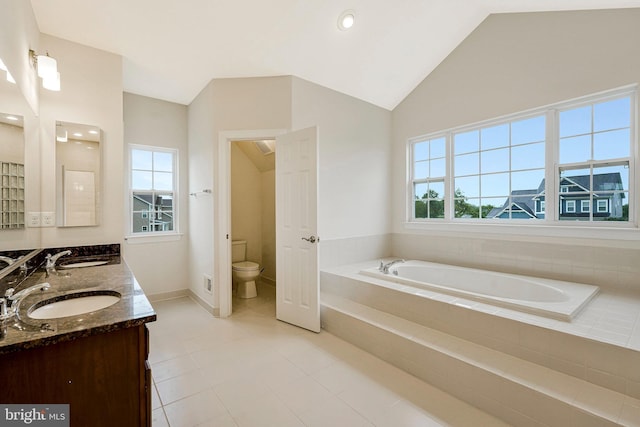 42506 Black Talon Ct, Leesburg, VA 20176 - bathroom featuring a bath, toilet, double vanity, vaulted ceiling, and tile patterned flooring