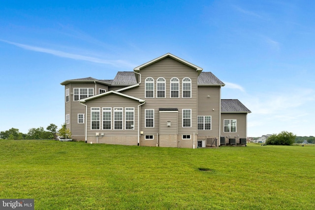 42506 Black Talon Ct, Leesburg, VA 20176 - back of house with a lawn and a shingled roof