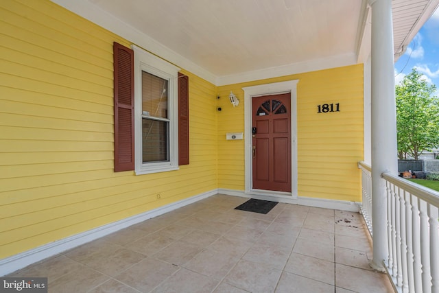doorway to property with a porch