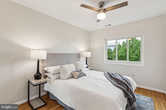 1 Christian St Unit 49, Philadelphia, PA 19147 - bedroom with baseboards, wood finished floors, and ceiling fan