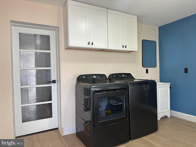 3406 Richmond St, Philadelphia, PA 19134 - washroom with separate washer and dryer, cabinet space, light wood-type flooring, and baseboards