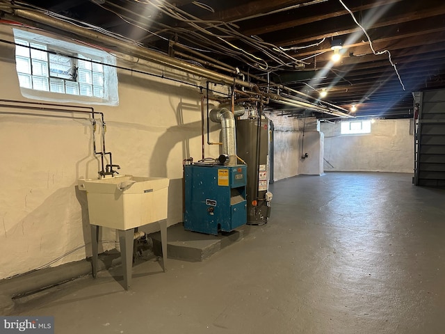 3406 Richmond St, Philadelphia, PA 19134 - below grade area with gas water heater, a sink, and a heating unit