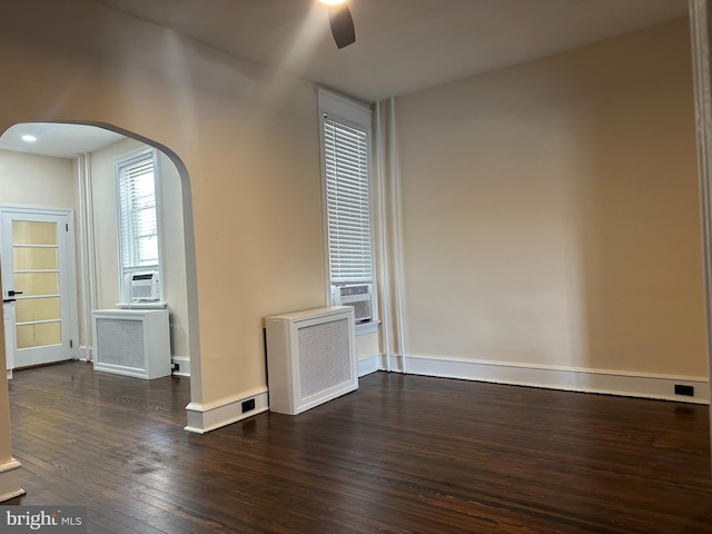 3406 Richmond St, Philadelphia, PA 19134 - spare room with arched walkways, ceiling fan, hardwood / wood-style floors, and baseboards