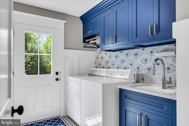 laundry room with washer and dryer and cabinet space