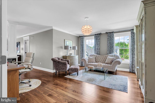 living room with baseboards, wood finished floors, ornamental molding, and an office area