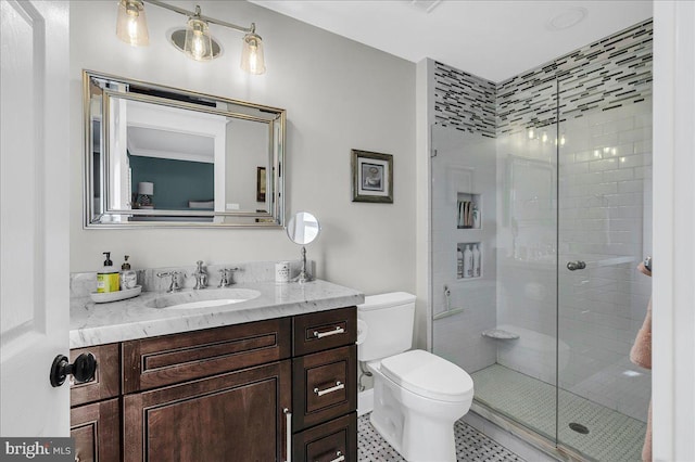 full bath featuring a stall shower, toilet, vanity, and tile patterned flooring