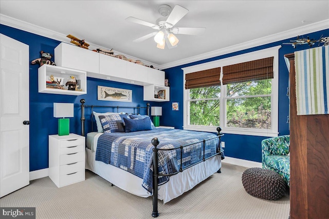 bedroom with carpet flooring, baseboards, ornamental molding, and ceiling fan