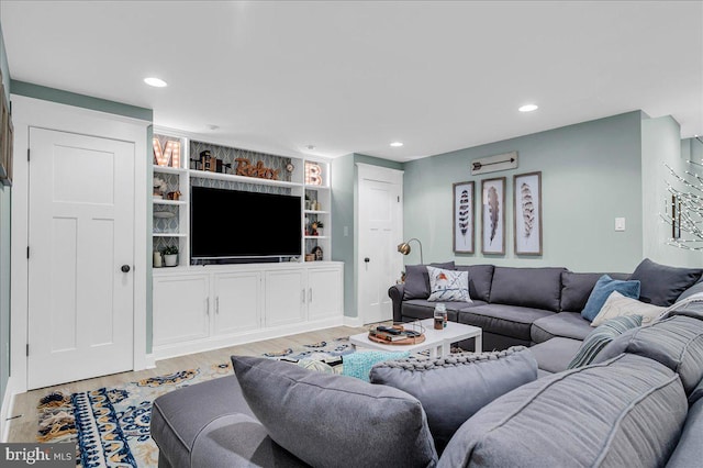 living room with recessed lighting and light wood finished floors