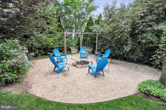 view of patio / terrace with a fire pit