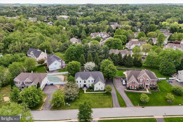 aerial view of residential area with a forest