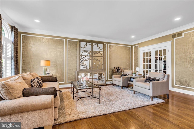 living room with wood finished floors, crown molding, french doors, baseboards, and recessed lighting