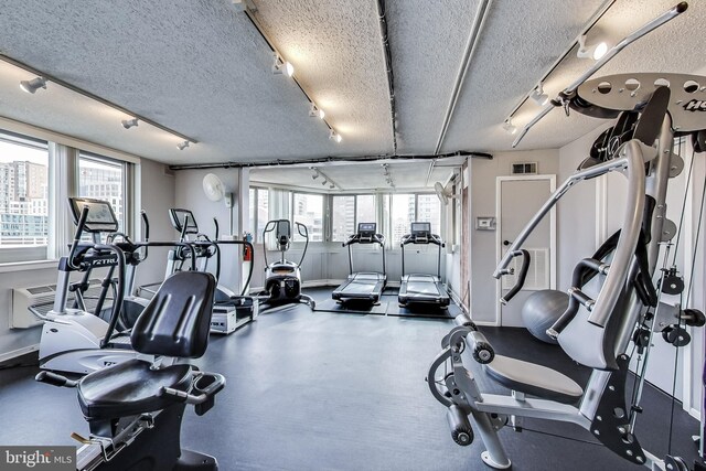 1001 N Vermont St Unit 403, Arlington, VA 22201 - gym with track lighting, baseboards, and a textured ceiling