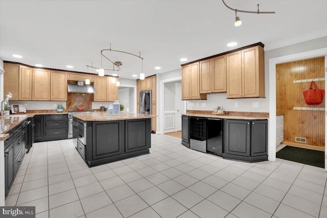 6014 Marilyn Dr, Alexandria, VA 22310 - kitchen with under cabinet range hood, a sink, recessed lighting, stainless steel appliances, and a center island