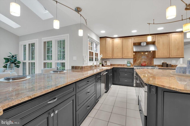 6014 Marilyn Dr, Alexandria, VA 22310 - kitchen featuring light tile patterned floors, a skylight, light stone countertops, recessed lighting, and backsplash