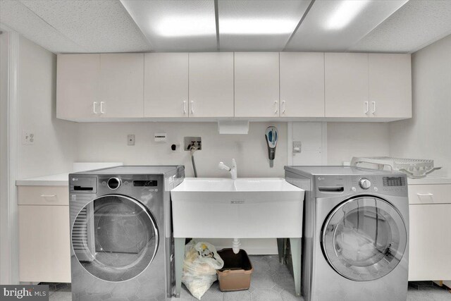 6014 Marilyn Dr, Alexandria, VA 22310 - laundry room with cabinet space and washer and dryer