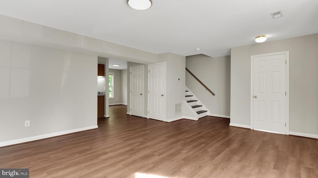 19645 Point Lookout Rd, Lexington Park, MD 20653 - unfurnished room featuring wood finished floors, stairway, and baseboards