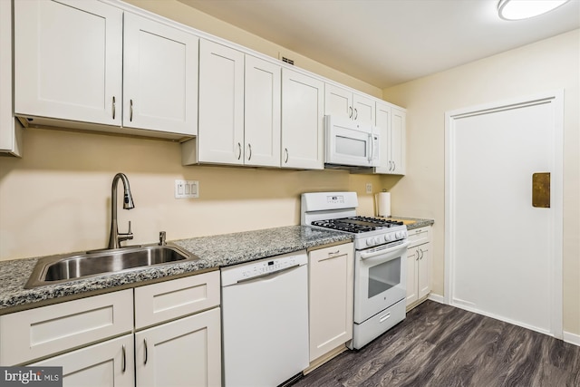 4100 Cathedral Ave NW Unit 818, Washington, DC 20016 - kitchen with white appliances, a sink, dark wood-style floors, and white cabinets