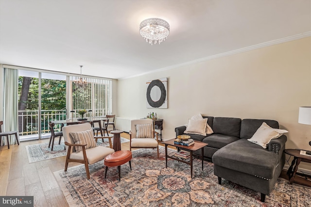4100 Cathedral Ave NW Unit 818, Washington, DC 20016 - living area featuring a chandelier, light wood-style flooring, crown molding, and expansive windows