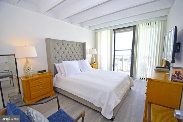 7604 Coastal Hwy Unit 2B, Ocean City, MD 21842 - bedroom featuring beam ceiling and wood finished floors