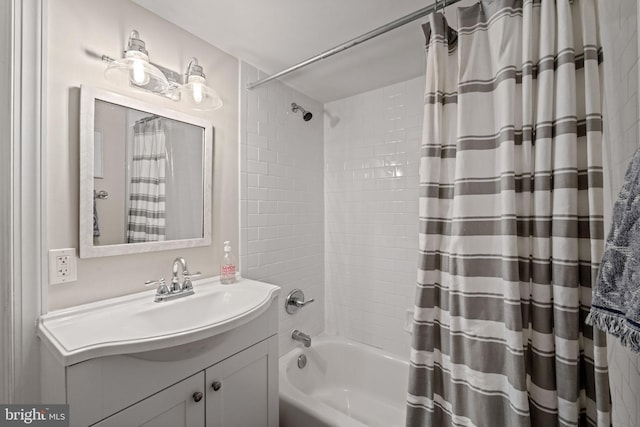 bathroom with shower / bath combo and vanity