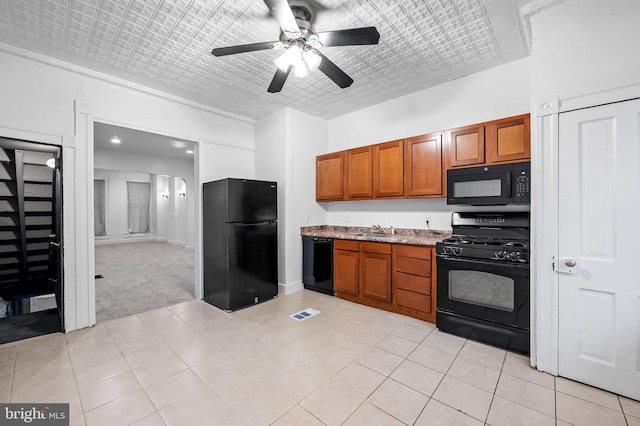 2717 Mosher St, Baltimore, MD 21216 - kitchen with black appliances, a sink, a ceiling fan, and brown cabinetry