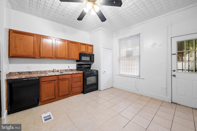 2717 Mosher St, Baltimore, MD 21216 - kitchen featuring black appliances, a sink, brown cabinets, ceiling fan, and light tile patterned floors