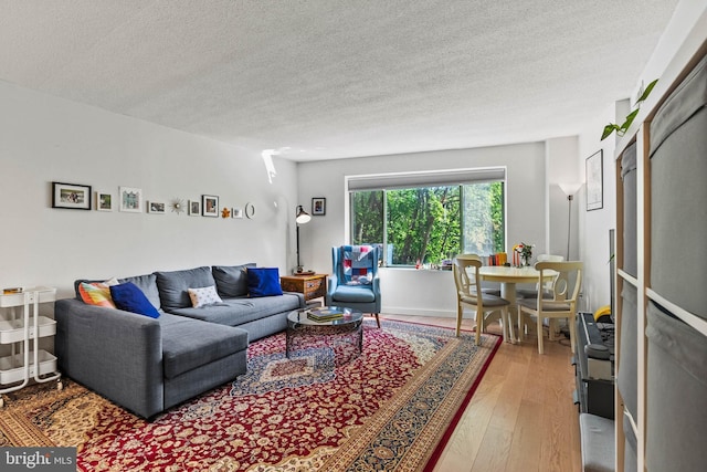 2141 Wisconsin Ave NW Unit 103, Washington, DC 20007 - living room featuring hardwood / wood-style flooring and a textured ceiling