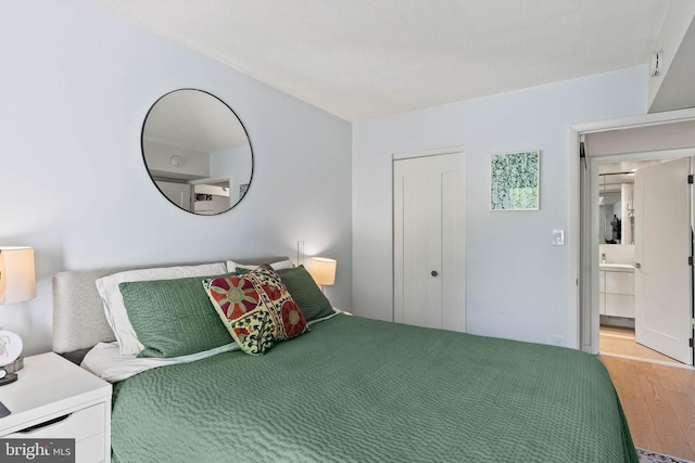 2141 Wisconsin Ave NW Unit 103, Washington, DC 20007 - bedroom with light wood-style flooring and a closet