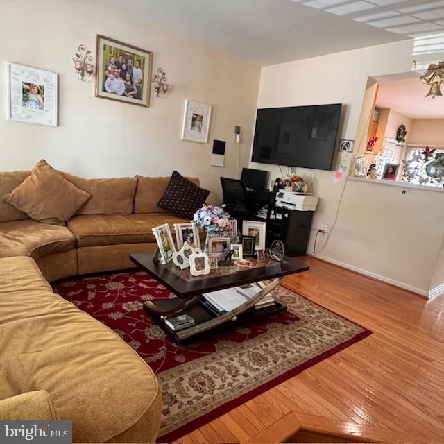 9330 China Grove Ct, Manassas, VA 20110 - living area featuring wood finished floors and baseboards