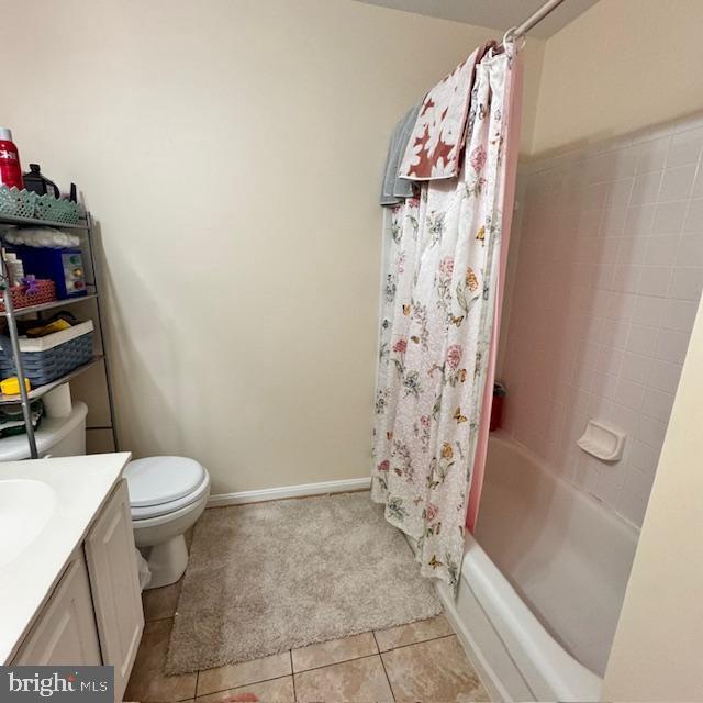 9330 China Grove Ct, Manassas, VA 20110 - full bath featuring tile patterned flooring, vanity, and shower / bathtub combination with curtain